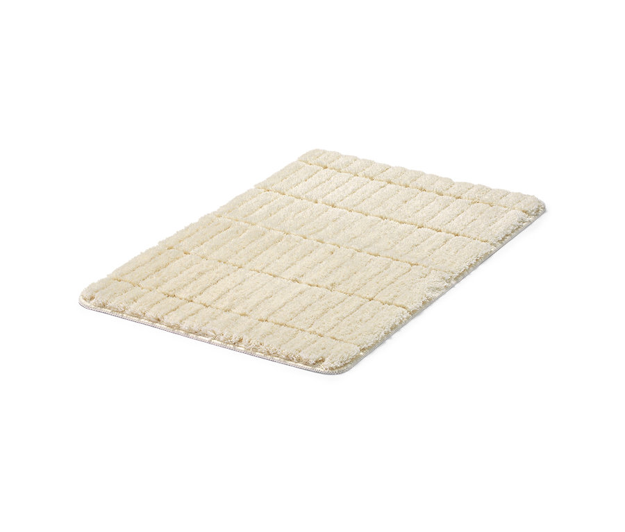 Krémově bílá předložka do koupelny Comfort o rozměrech cca 50 x 80 cm.