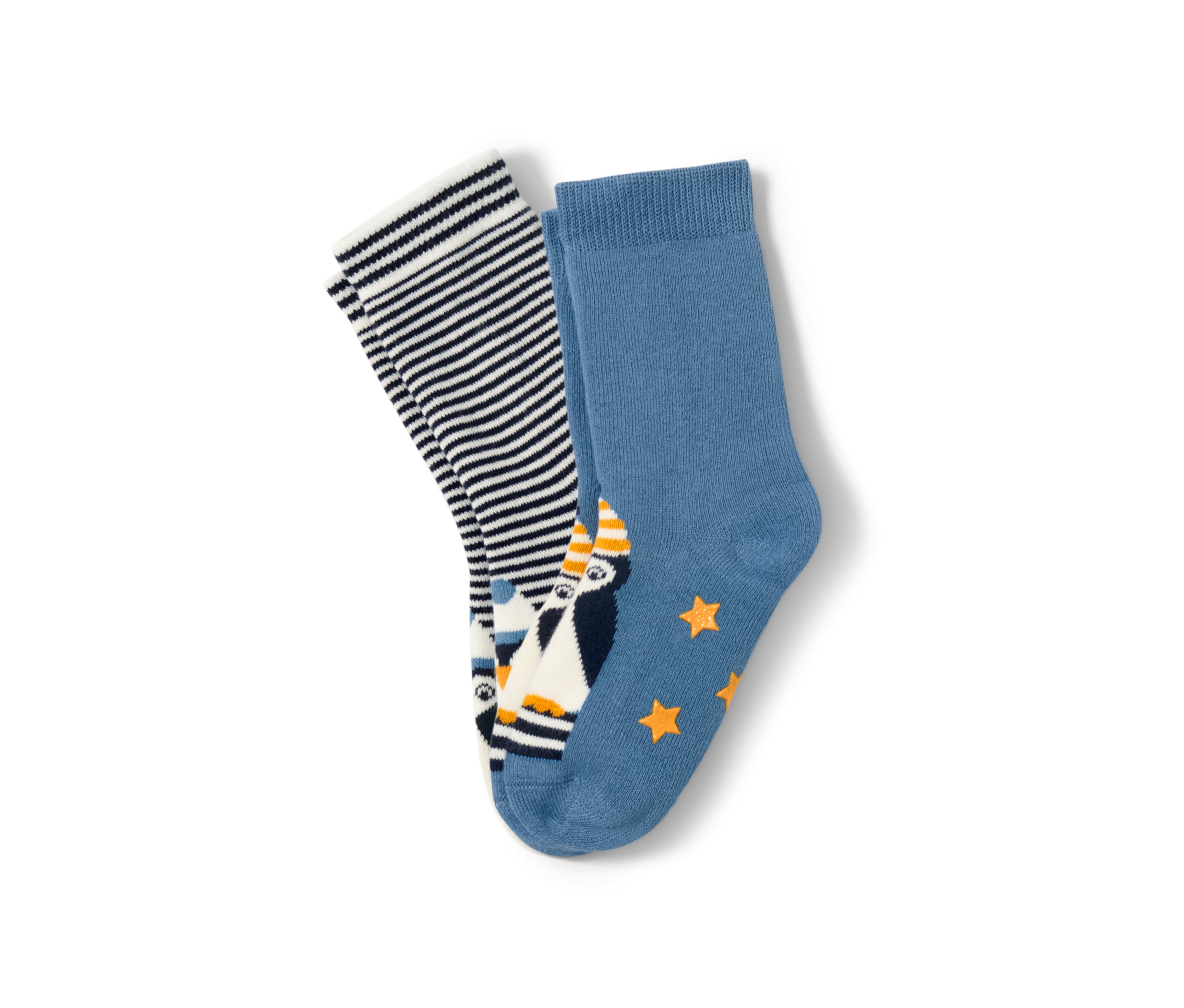 Dva páry dětských protiskluzových ponožek. Jeden pár je modrý s tučňákem a hvězdami, druhý s modrými a bílými proužky.