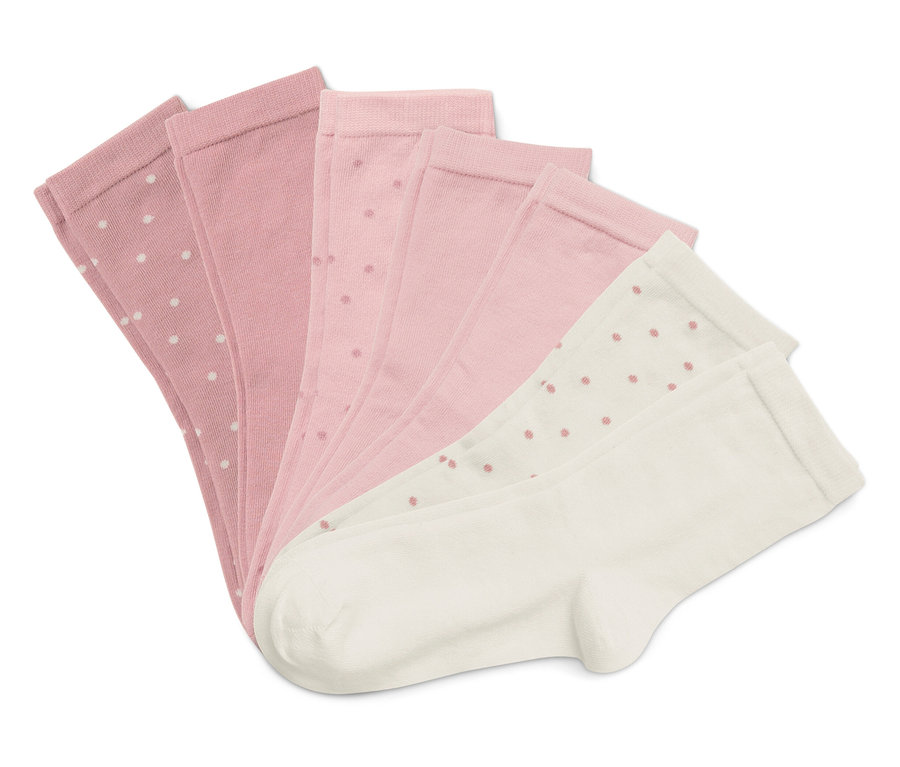 Pět ponožek uspořádaných do vějíře na bílém pozadí. Ponožky jsou růžové a bílé s puntíkovaným vzorem.