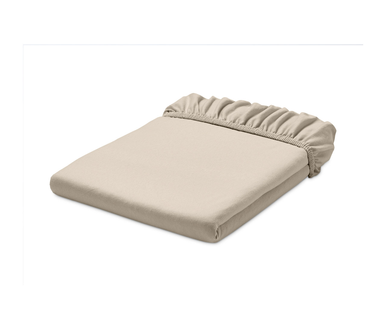 Složené krémové jerseyové napínací prostěradlo.