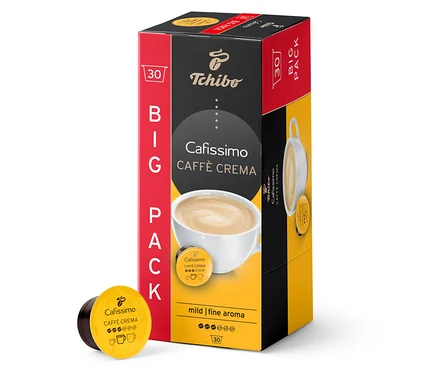 Balení 30 kapslí Caffè Crema jemná. Krabička je červeno-černo-žlutá. Kapsle leží vedle balení.
