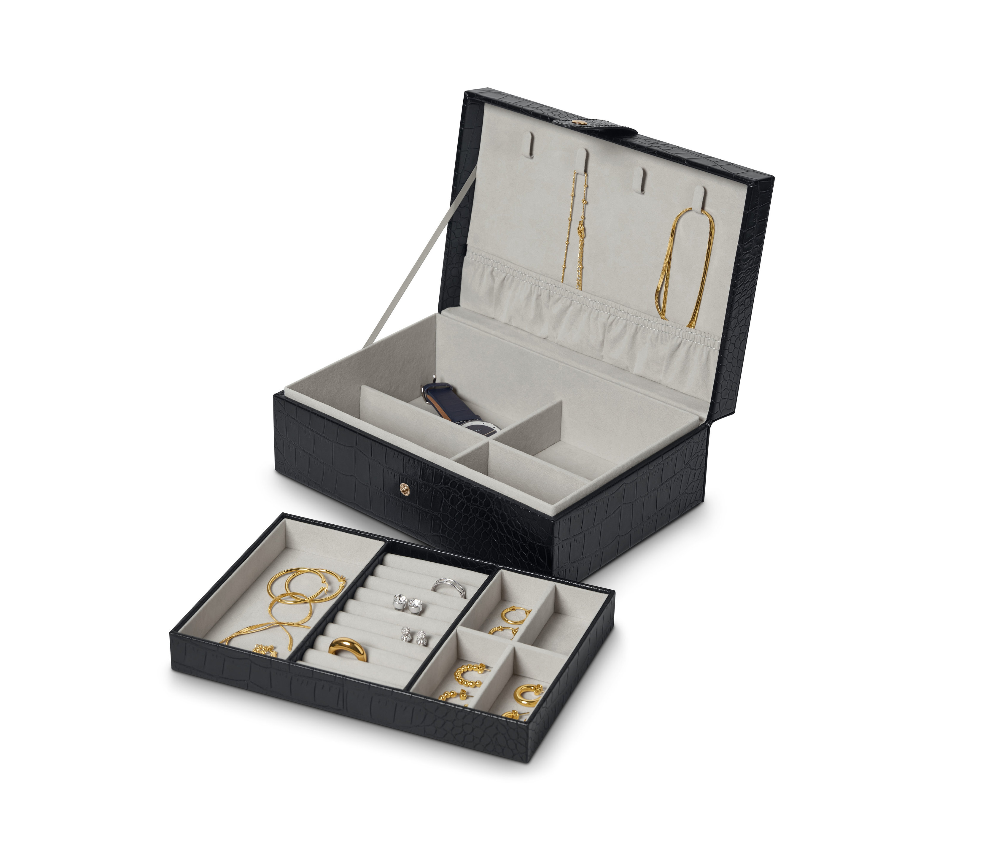Otevřená černá šperkovnice s elegantním vzorem, uvnitř šperky.