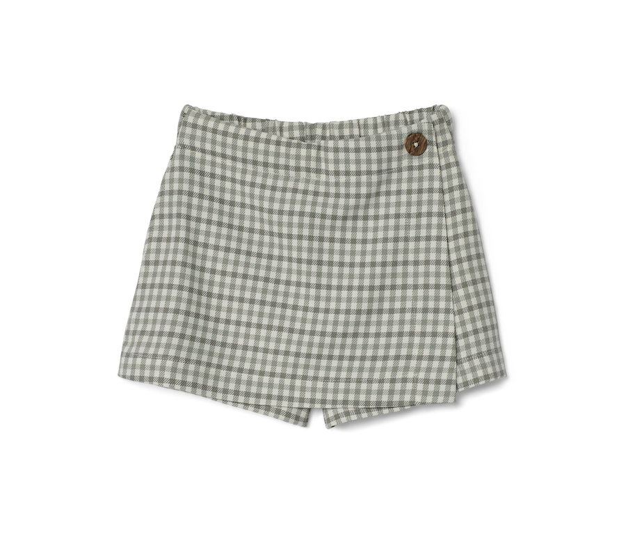Dívčí kalhotová sukně s kostkovaným vzorem a dřevěným knoflíkem.