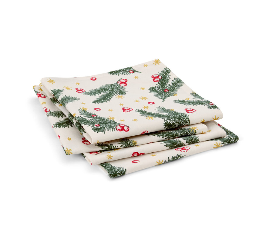 Sada čtyř ubrousků s vánočním motivem. Na ubrouscích jsou zelené větvičky, červené bobule a zlaté hvězdičky.