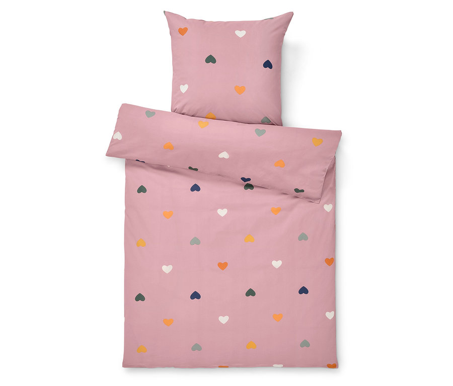 Růžové ložní prádlo s barevnými srdíčky.