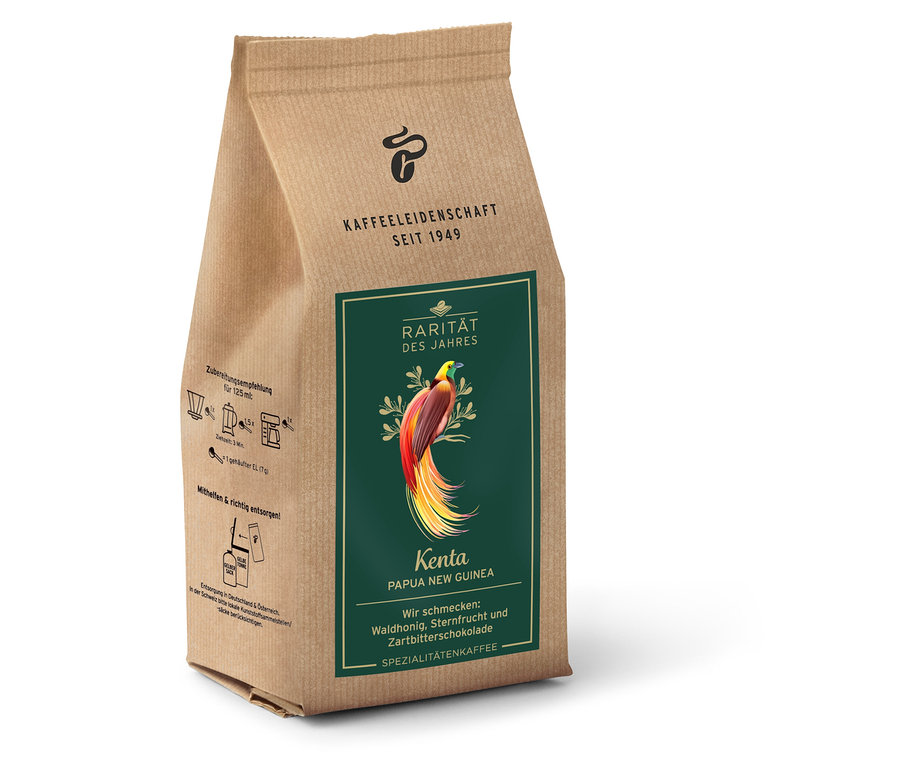 Neotevřené balení kávy Kenta Papua New Guinea Spezialitätenkaffee.