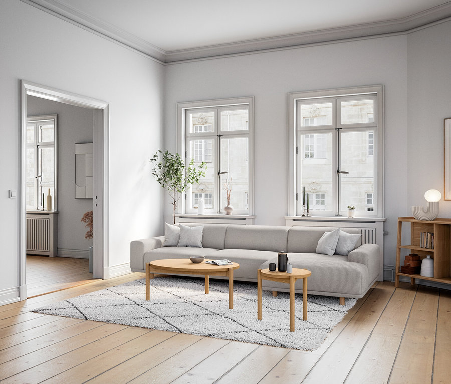 Obývací pokoj s komodou a designovou stolní LED lampou na dřevěném stolku vedle pohovky.