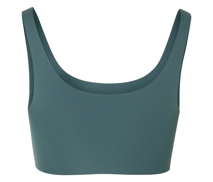 Detailní záběr na zelenou sportovní podprsenku.