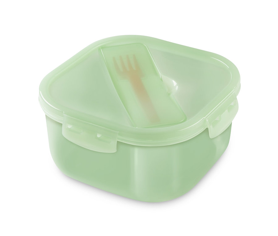 Zelený cestovní box na svačinu se světle hnědou vidličkou uvnitř.