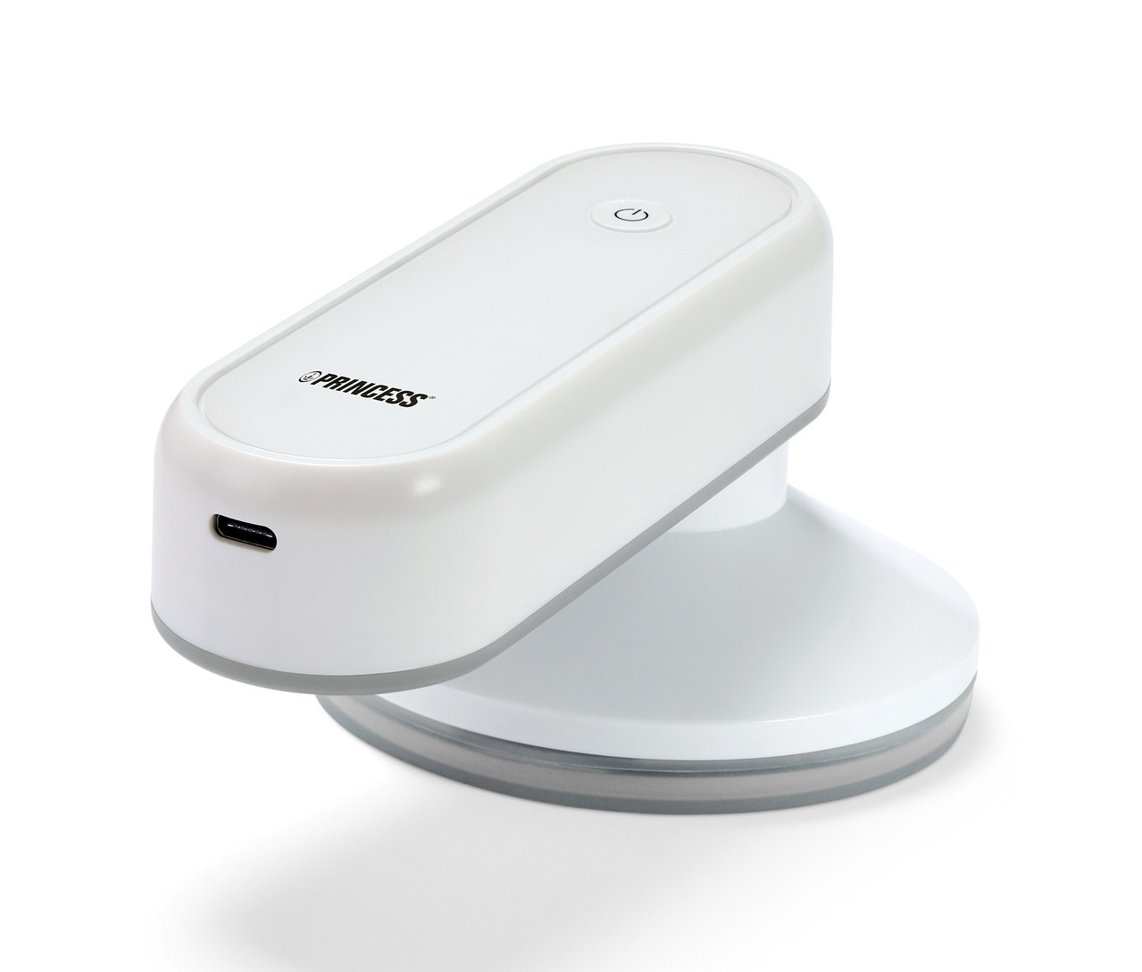 Bílá akumulátorová žehlička Princess s powerbankou na bílém pozadí.