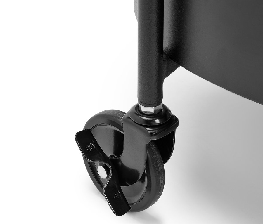 Detail of a black metal cart wheel with a brake in the off position.