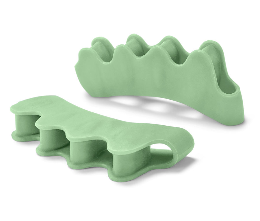 Dva zelené separátory prstů na nohou.