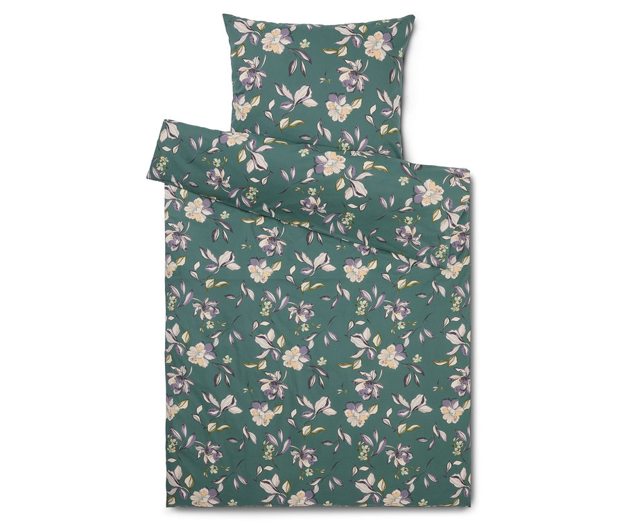 Sada ložního prádla s květinovým vzorem na zeleném pozadí, skládající se z povlaku na polštář a povlaku na přikrývku.