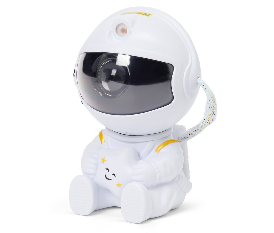 Astronaut v bílém obleku sedí a drží hvězdu.