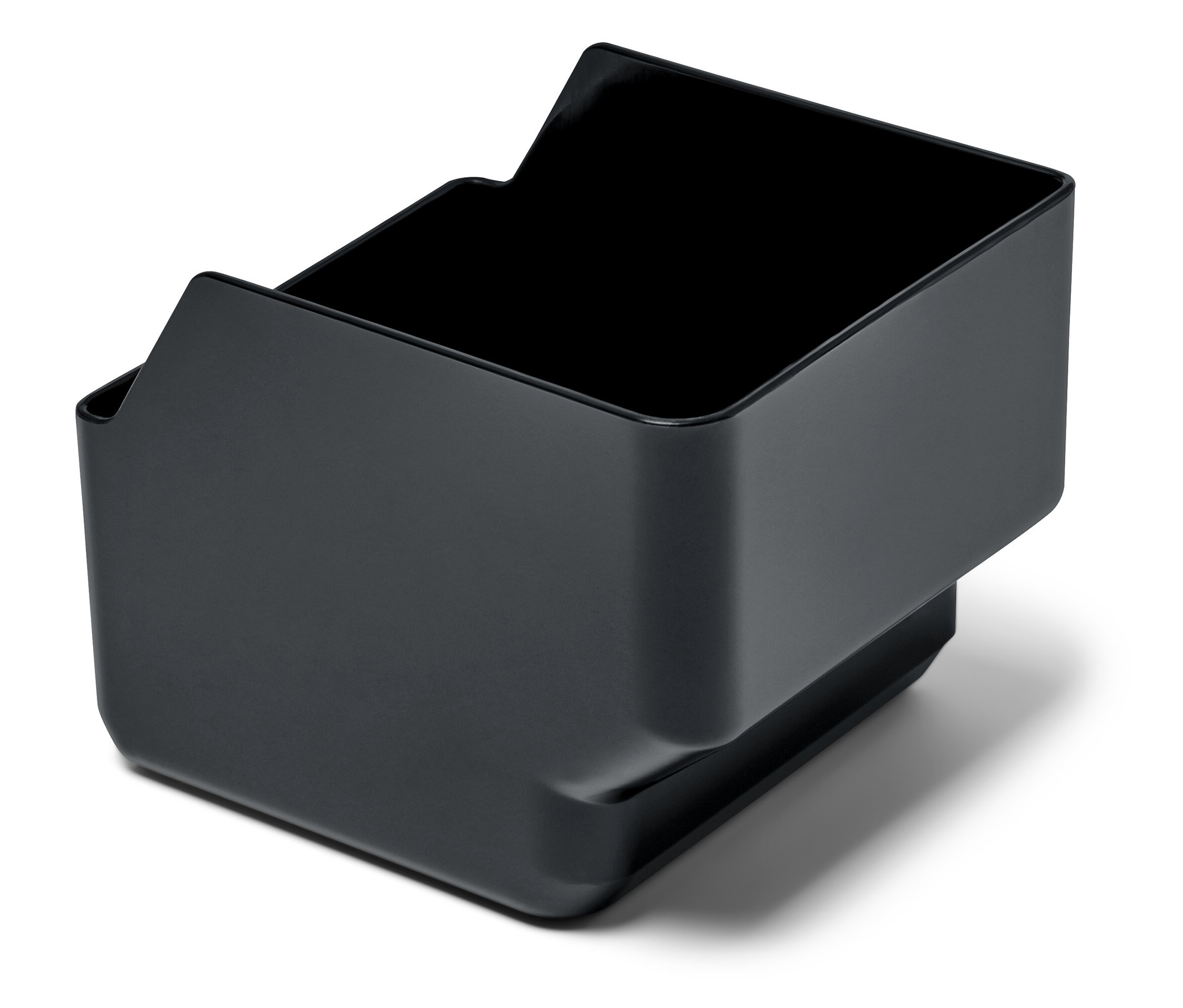 Černá nádobka na kávovou sedlinu pro plnoautomatické kávovary Tchibo.