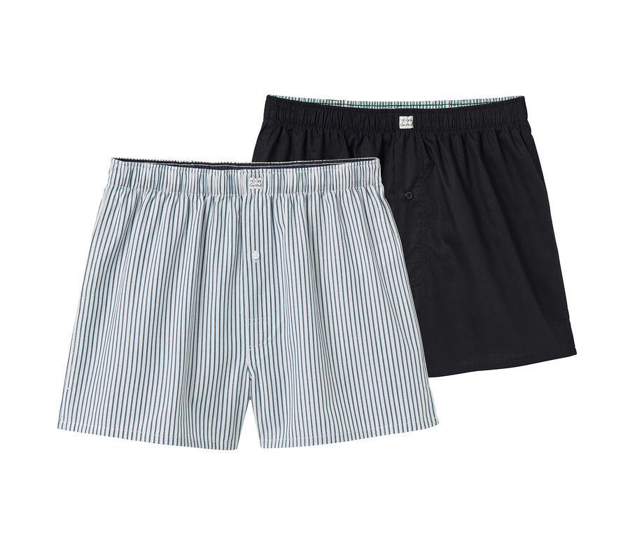 Dvoje tkané boxerky: jedny svislé modro-bílé pruhy, jedny černé.