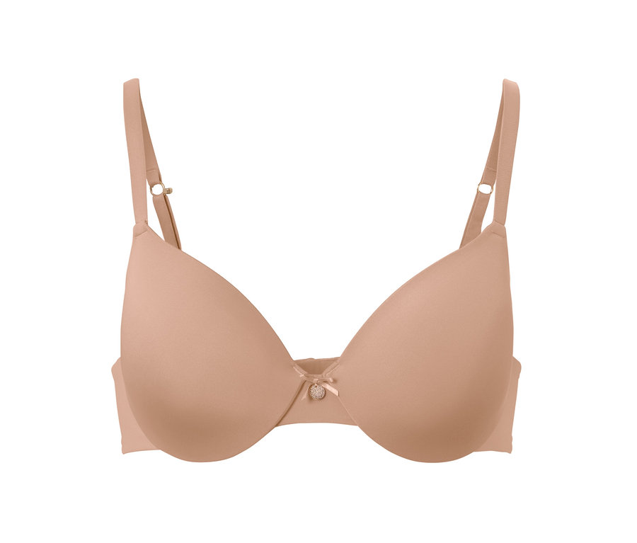 Béžová podprsenka pod tričko s mašličkou uprostřed.