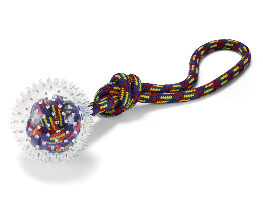 Hračka pro psy s průhlednou koulí a barevným lanem.