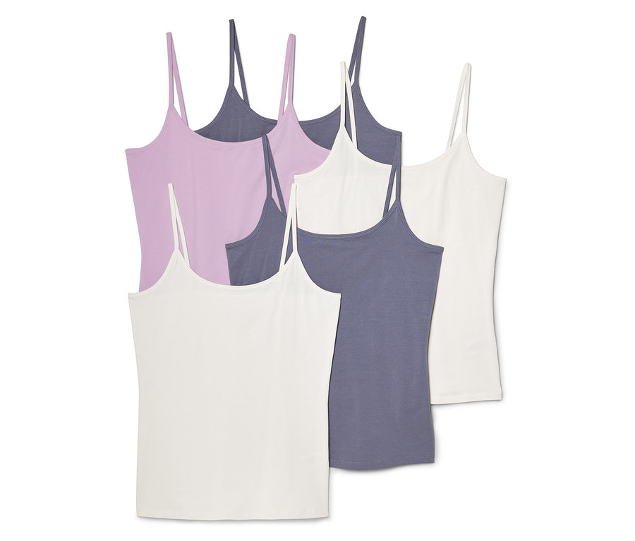 Pět tílek na špagetová ramínka v bílé, fialové a šedě modré barvě leží na sobě.