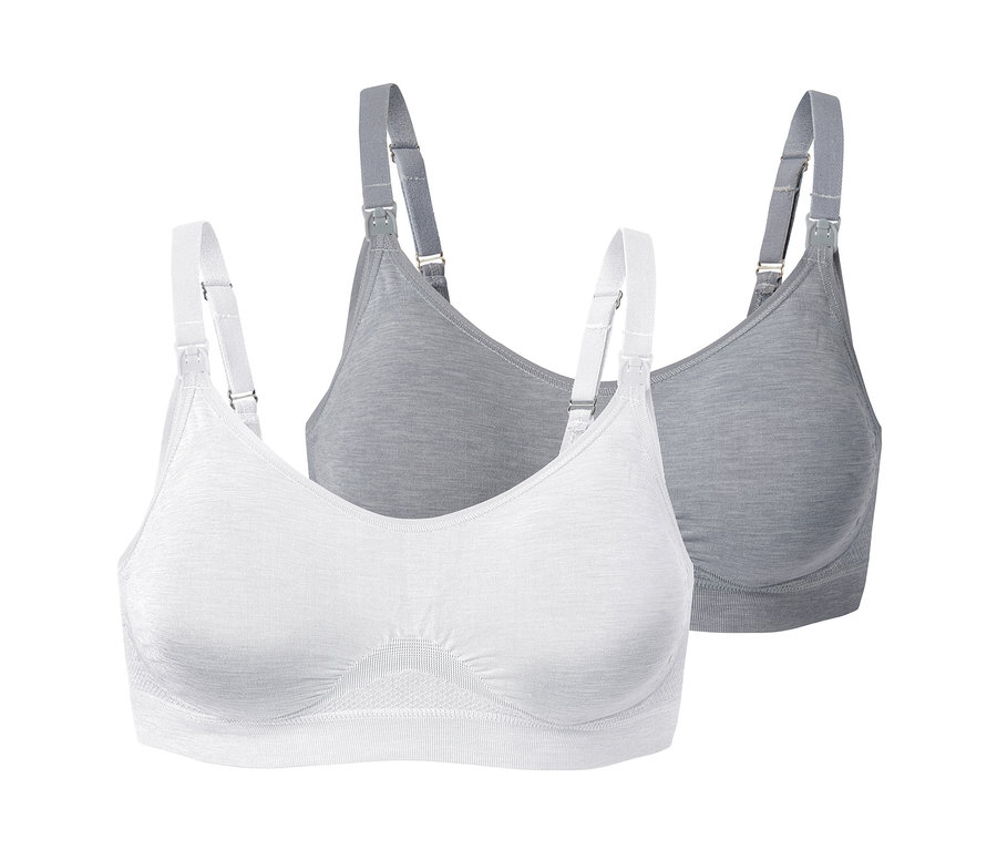 Dvě bezešvé podprsenky na kojení, jedna bílá a jedna šedá, s bílými ramínky.