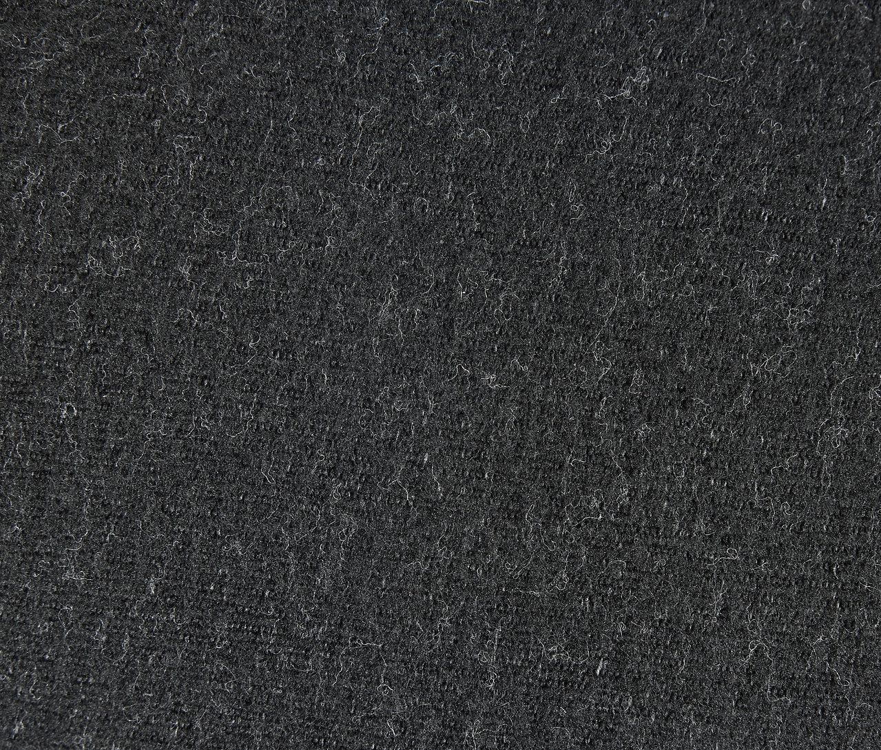 Detailní záběr na šedou textilní texturu.