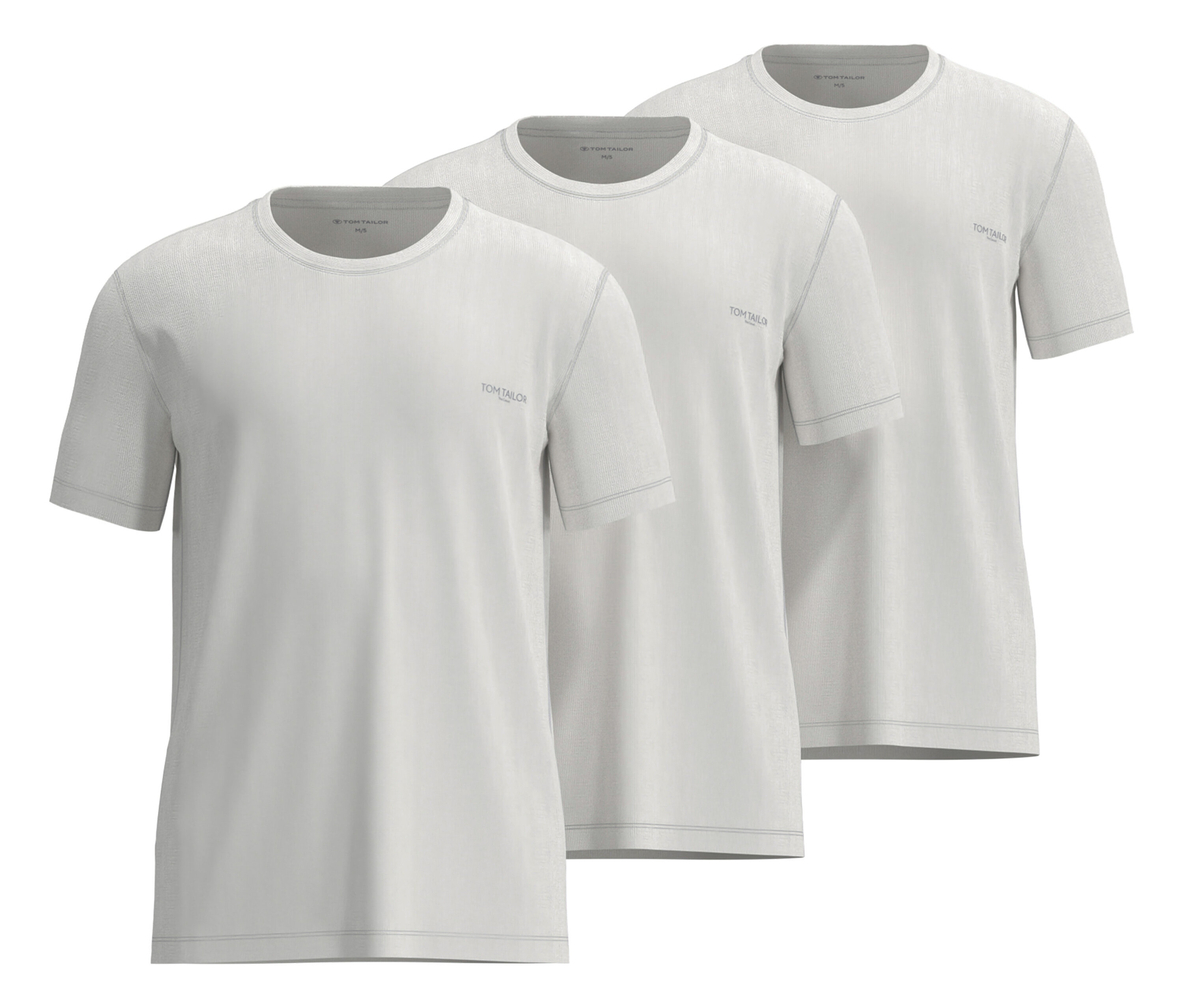 Tři bílá trička Tom Tailor »Ohio«, 3 ks, leží na sobě.
