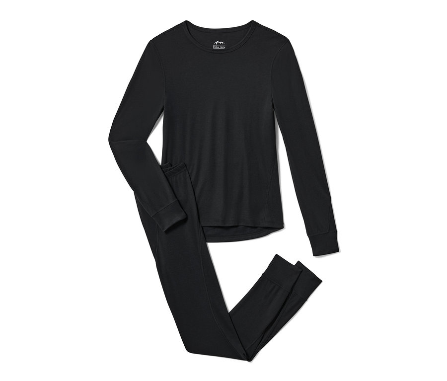 Černé funkční termoprádlo a spodní termoprádlo leží na bílém pozadí.