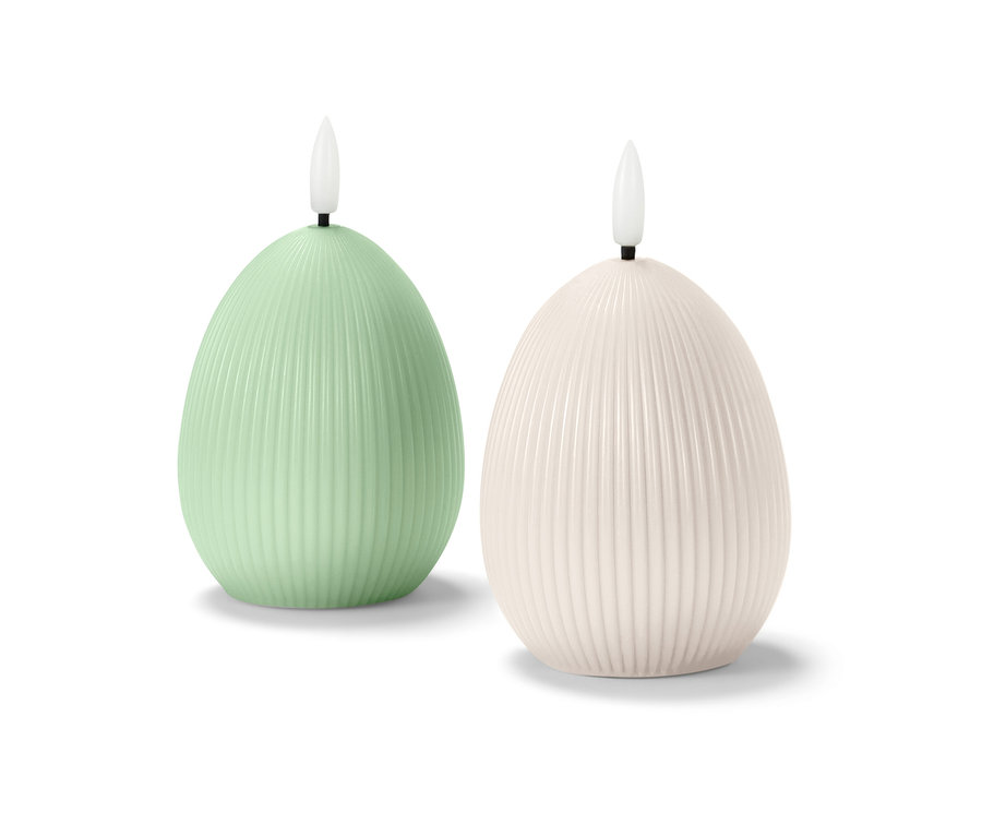 Dvě LED svíčky z pravého vosku ve tvaru vejce.