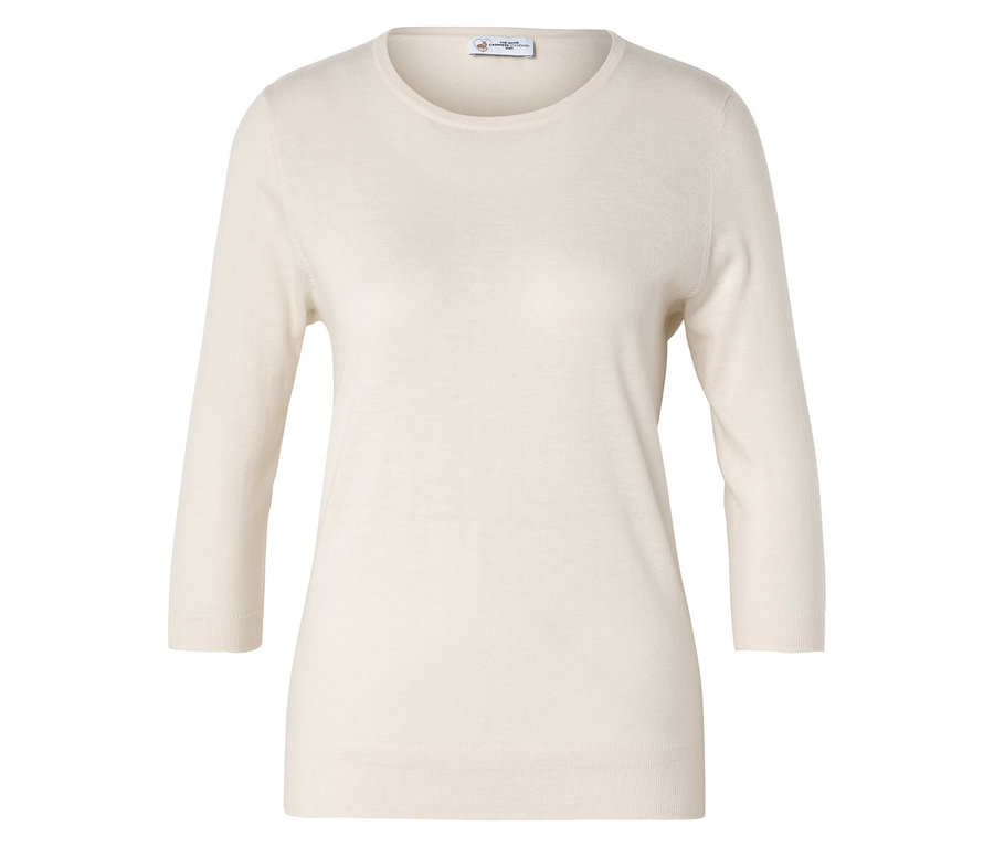 Krémový svetr s tříčtvrtečními rukávy leží naplocho.