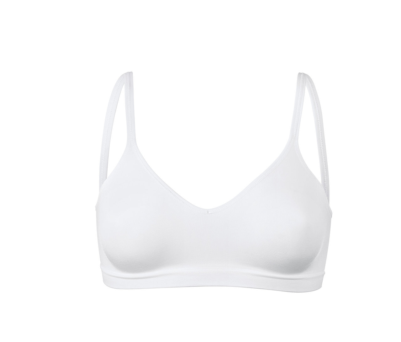 Bílá bezešvá měkká podprsenka na bílém pozadí.
