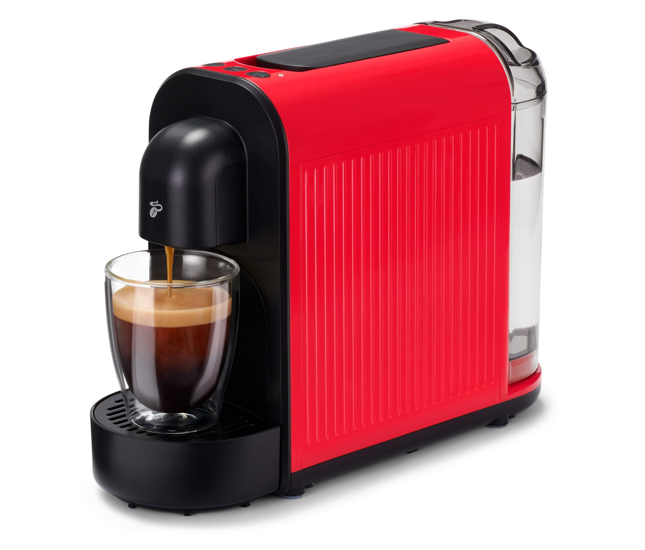 Espresso teče do sklenice pod červeným Cafissimo now.