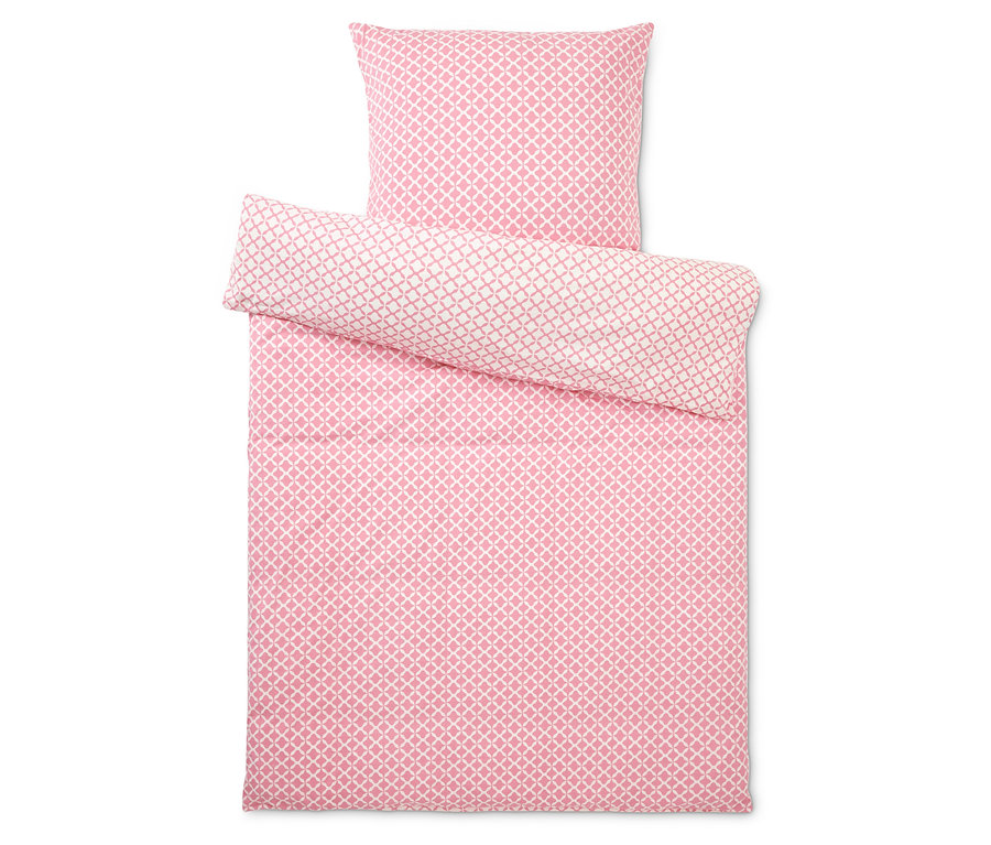 Sada ložního prádla s geometrickým vzorem v růžovo-bílé barvě, skládající se z povlaku na polštář a přikrývku.