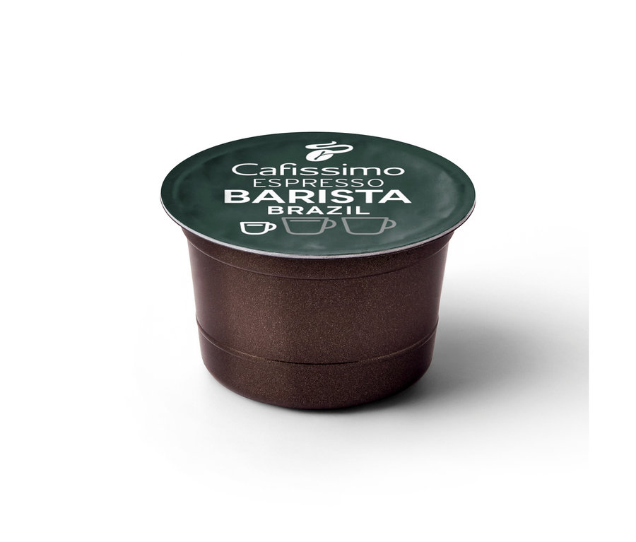 Hnědá kávová kapsle Cafissimo BARISTA Espresso Brasil s tmavě zeleným víčkem. Na víčku je bílý nápis 'Cafissimo ESPRESSO BARISTA BRAZIL', logo Tchibo a tři ikony šálků kávy.