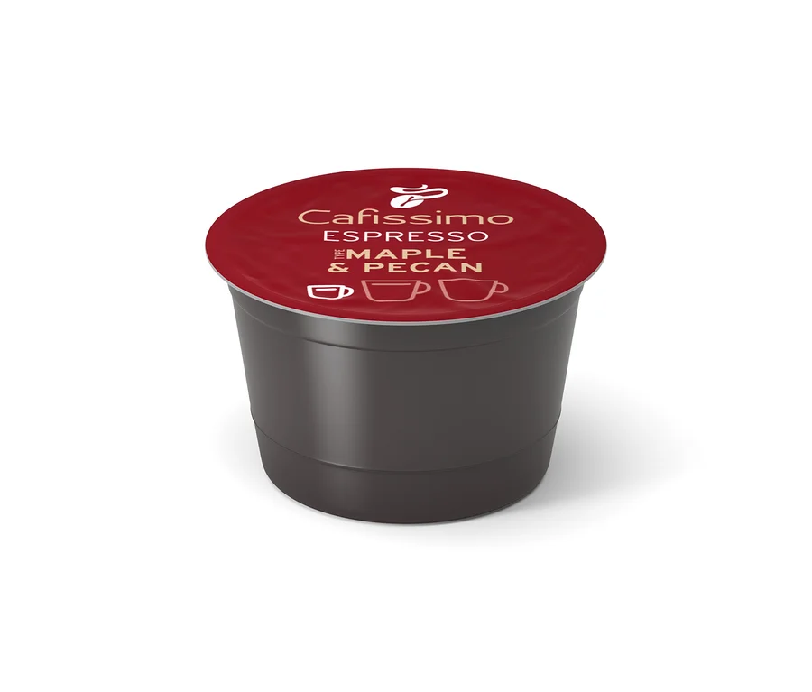 Tmavě šedá kávová kapsle Cafissimo s červeným víčkem, na kterém je nápis "Espresso Maple & Pecan" a ikony šálků.