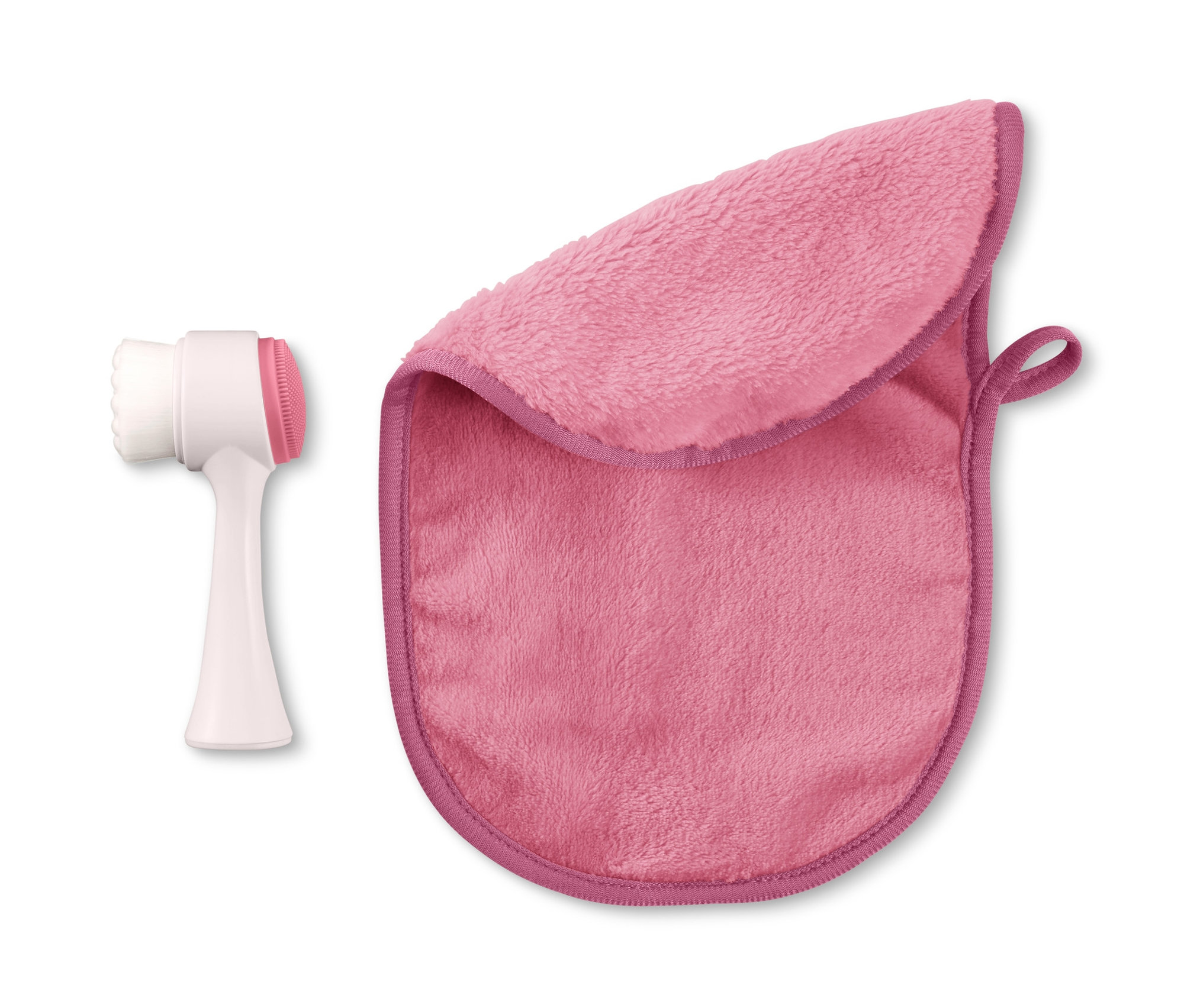 Čisticí kartáček na obličej a kosmetický ručníček leží vedle sebe.