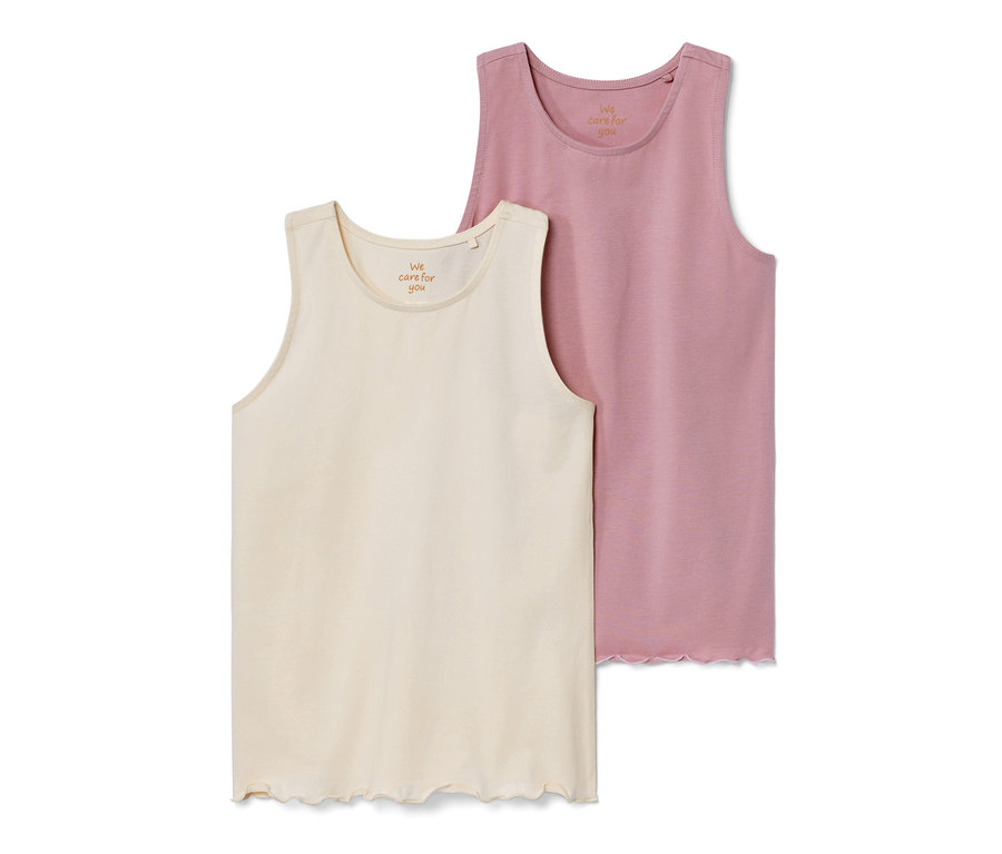 Dva dětské topy: krémový a růžový.