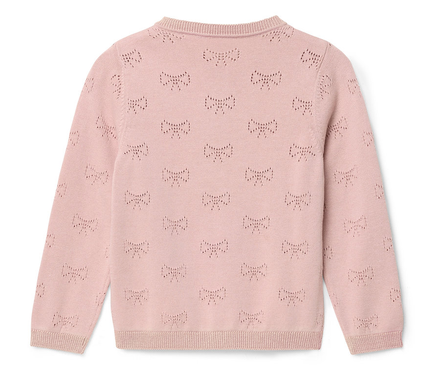 Růžový svetřík s mašličkami.