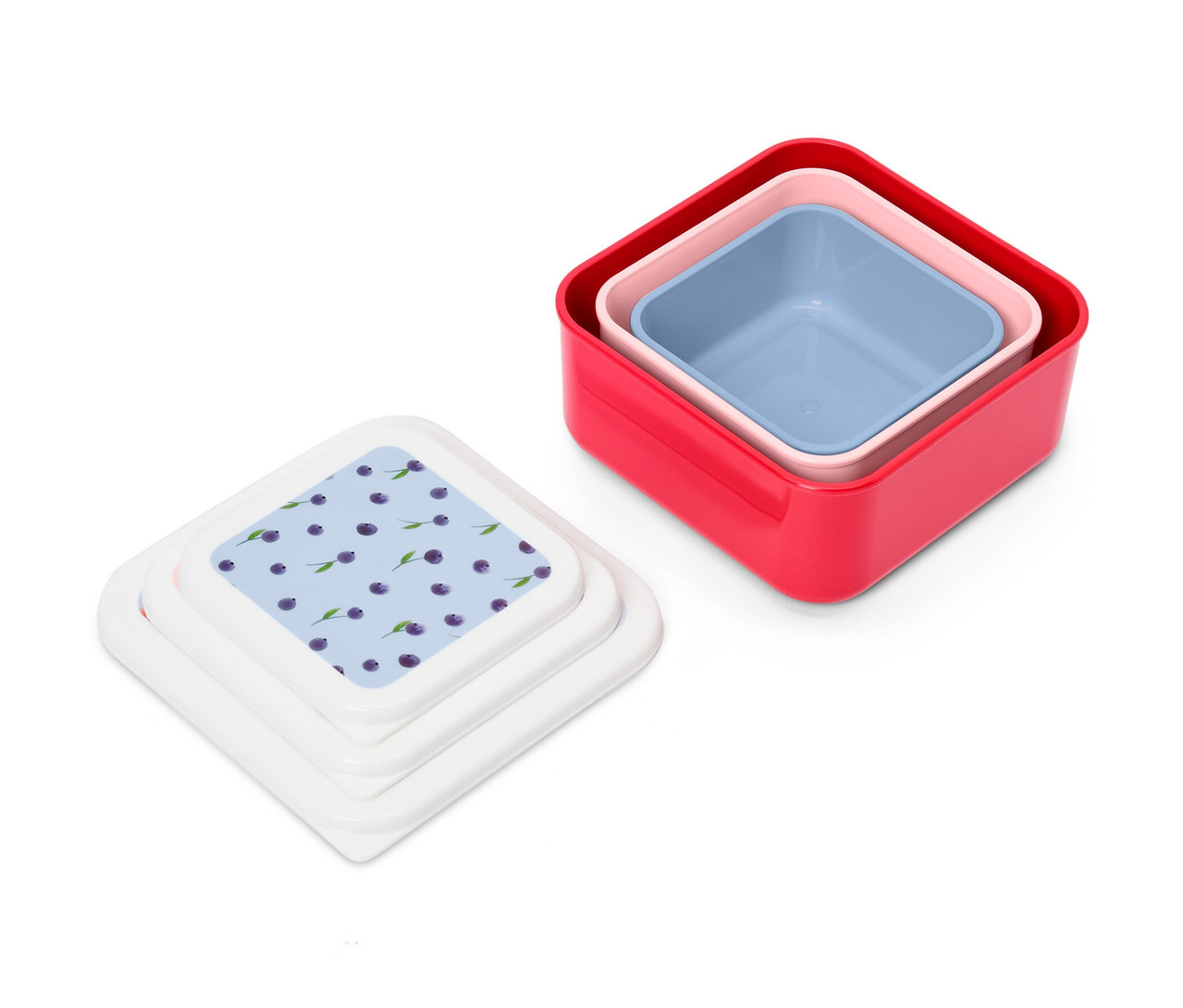 Sada tří krabiček na pamlsky: červená, růžová a modrá. Vedle nich leží tři víčka s potiskem borůvek.