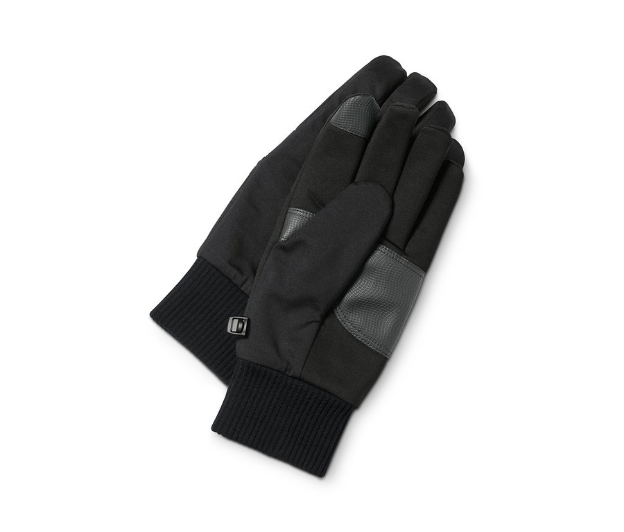 Dvě softshellové rukavice leží na bílém pozadí.