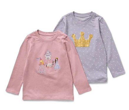 Dvě dětská trička s dlouhým rukávem s motivem princezny. Jedno tričko je růžové s obrázkem zámku a princezen, druhé fialové s motivem zlaté korunky a puntíků.