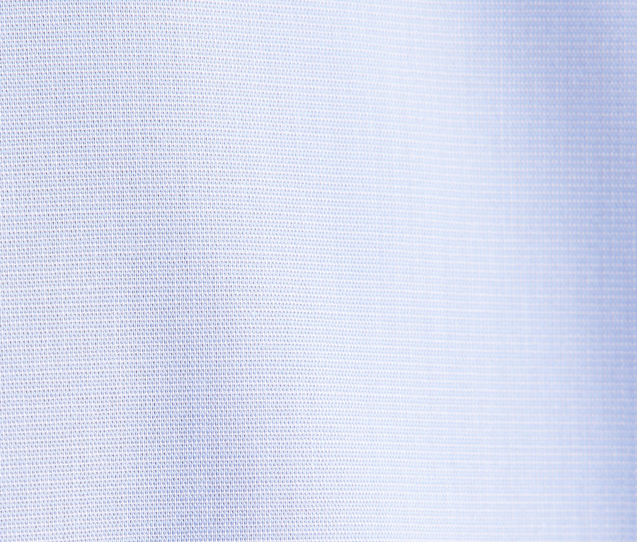 Detail světle modré tkaniny.
