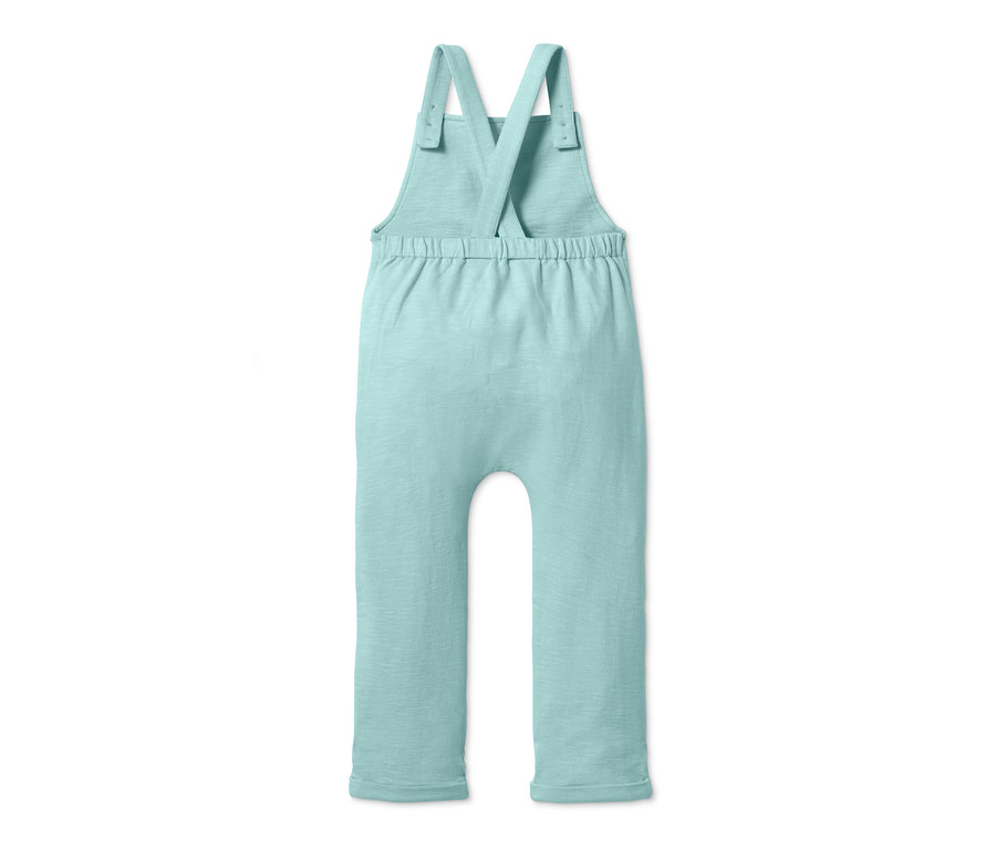 Světle zelené bavlněné kalhoty s laclem.