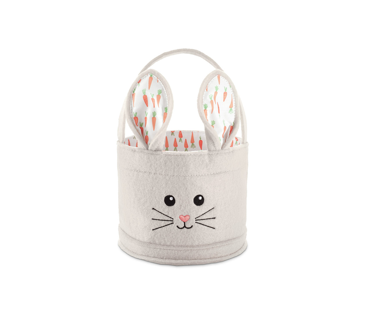 Bílý velikonoční košíček s obličejem králíka a oušky s mrkvovým vzorem.