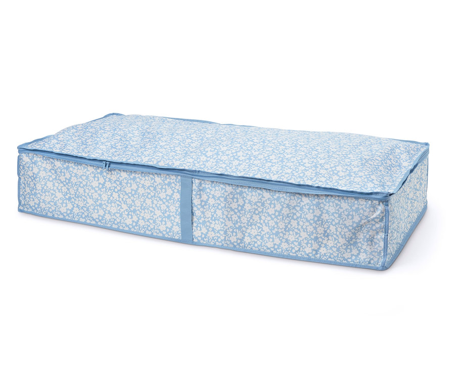 Komoda pod postel s modro-bílým květinovým vzorem a zipem.