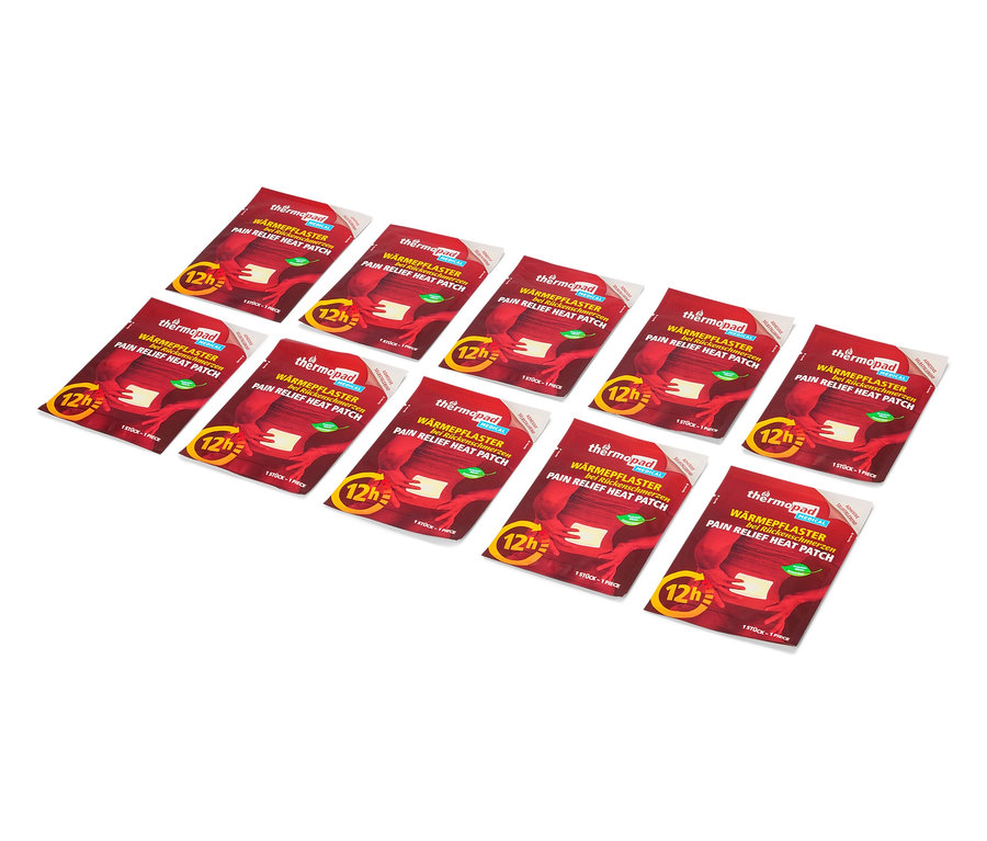 Několik hřejivých náplastí Thermopad leží na bílém pozadí.