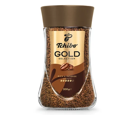 Sklenice instantní kávy Tchibo Gold Selection.