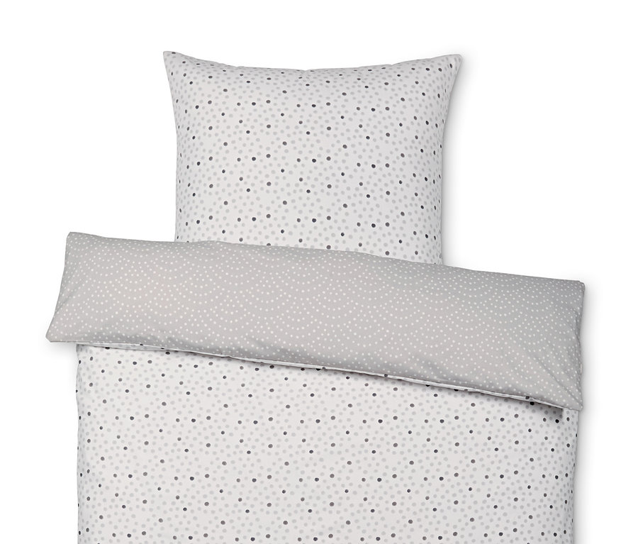 Renforcé povlečení standardní velikosti s šedým polštářem a přikrývkou s tečkovaným vzorem.