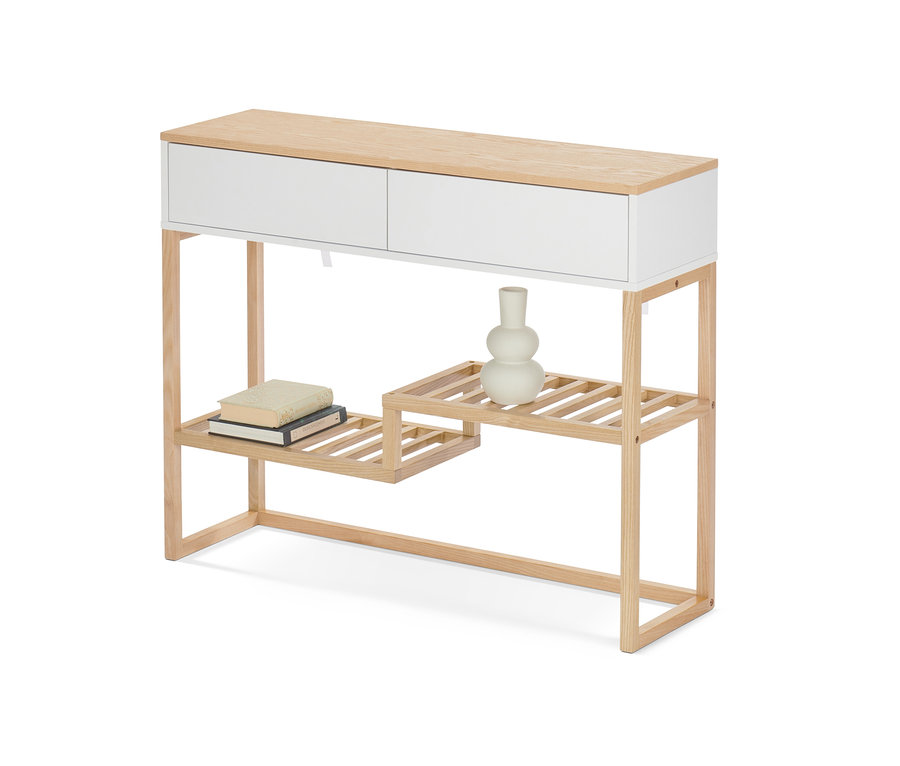 Konzolová skříňka se zásuvkami, na které leží knihy a váza.