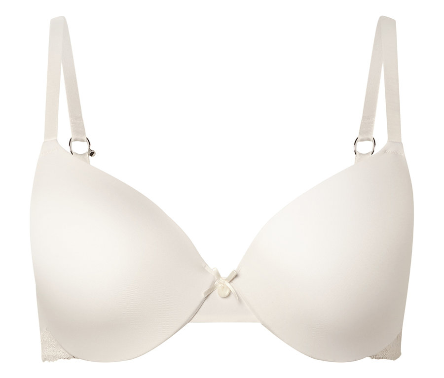 Podprsenka barvy slonové kosti s kosticemi a nastavitelnými ramínky, vycentrovaná na bílém pozadí.