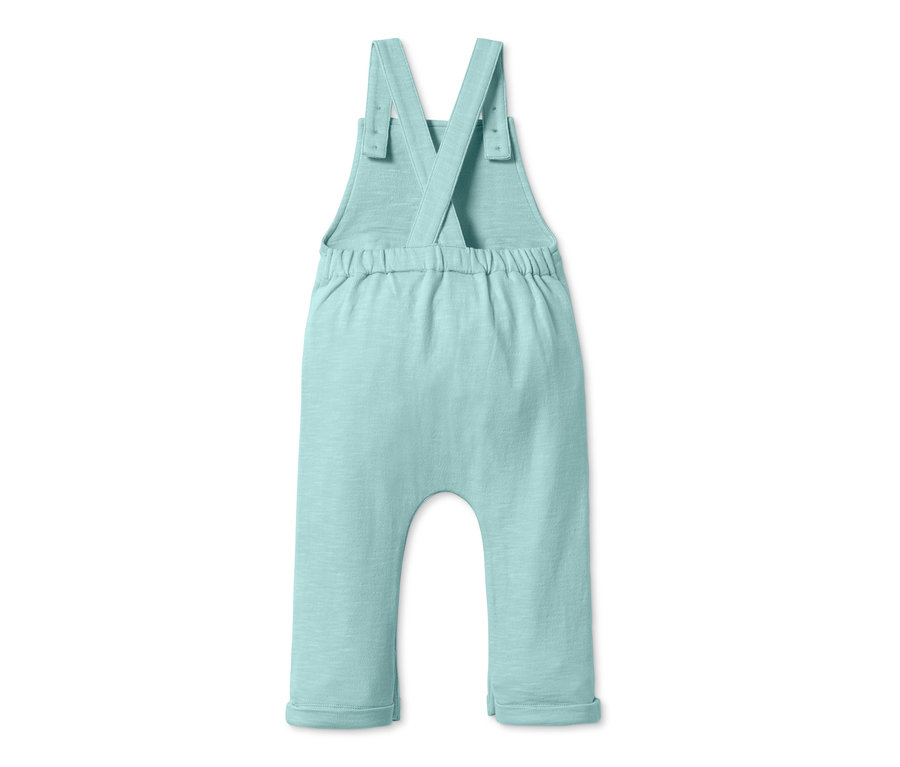 Světle zelené bavlněné kalhoty s laclem zezadu.